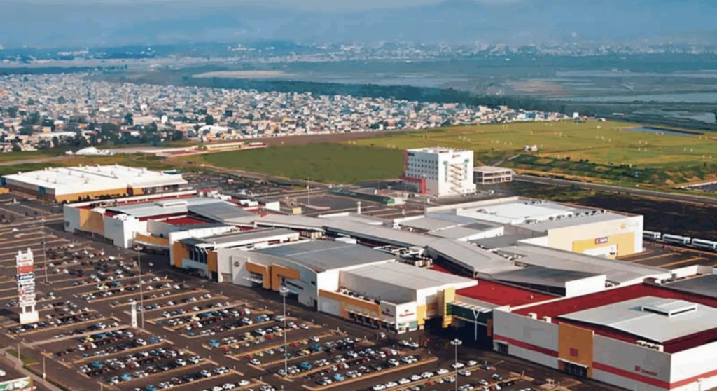 Aerial view of a large commercial complex and parking area